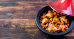 Tagine with cooked chicken, vegetables copy space